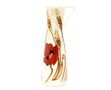 A Moorcroft pitcher in the 'Harvest Poppy' design standing approx. 19 cm high