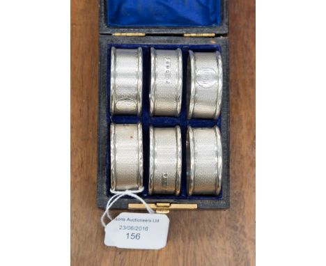 A set of six boxed silver napkin rings 99.5 grms 3.2 ozt approx., Birmingham 1880, engine turned pattern 