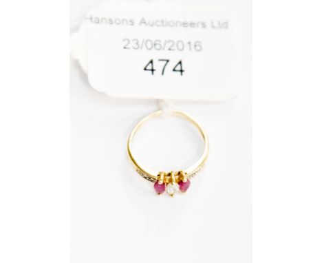 A marquis cut ruby and diamond three stone ring, small size I