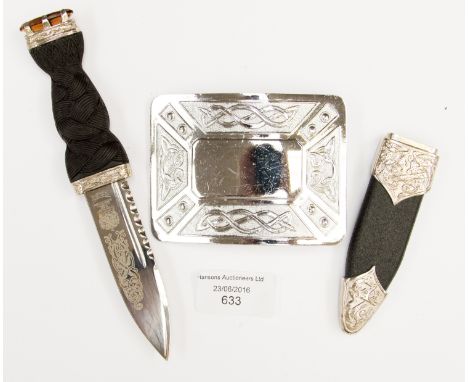 A white metal Celtic knot design dagger and belt buckle