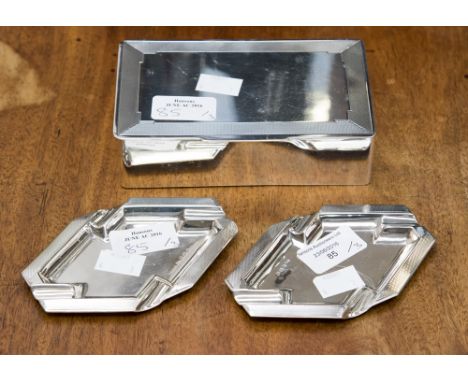 A silver cigarette box and a pair of matching ashtrays, all with engine turned design Birmingham 1945 gross weight 20.2 ozt/ 