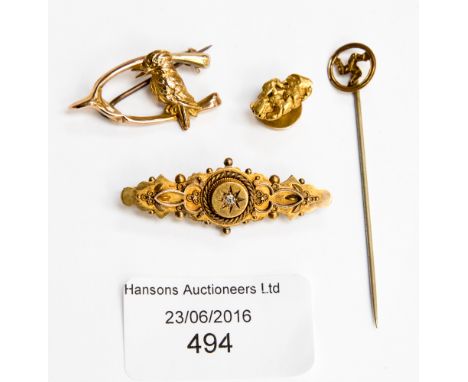 A 9 ct gold wishbone and kingfisher brooch, a Victorian brooch set with old cut diamonds, together with a gold nugget stud an