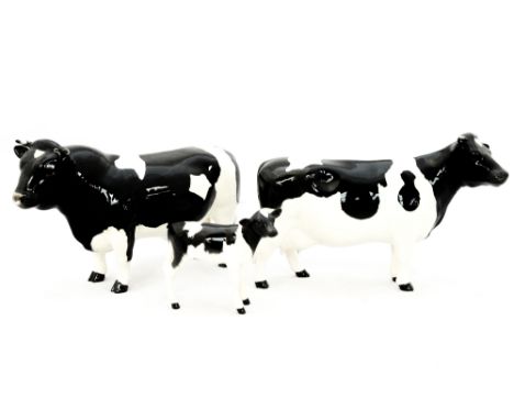 A Beswick Friesian bull, cow, calf, s.d.  (3)