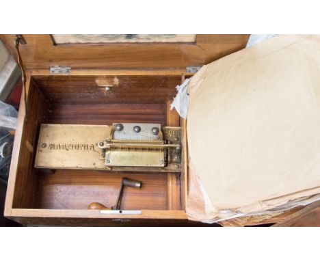 A late 19th Century Harmonica disc musical box, to take 10 inch metal discs, and 11 cm one-piece steel comb contained in waln