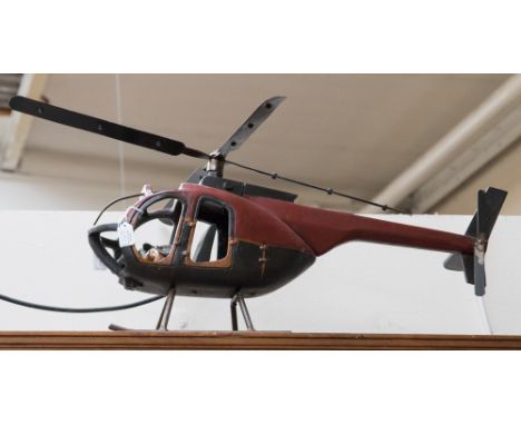A large model helicopter with pilot