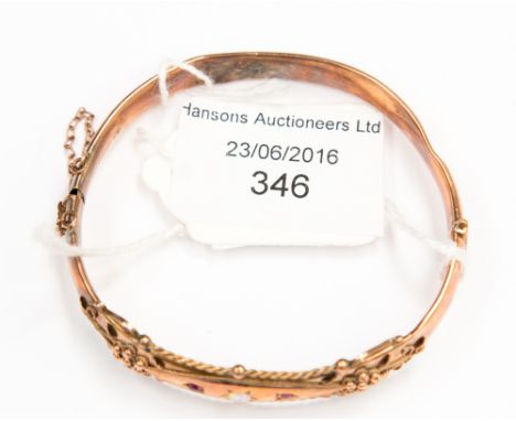 A rose gold bracelet, set with an opal and two rubies weighing approx. 10.4 grms a/f