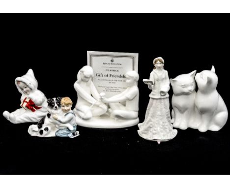 A collection of five Royal Doulton figures comprising 'Best Friends' HN3935, 'Baby's First Christmas' HN4427, an unnamed figu