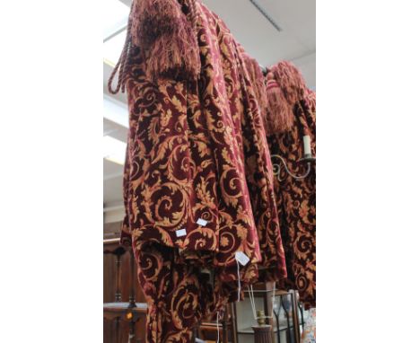 Two pairs of claret red curtains with scrolling leaf design in gold with two pairs tie back. One measure approx. 204x124cm an