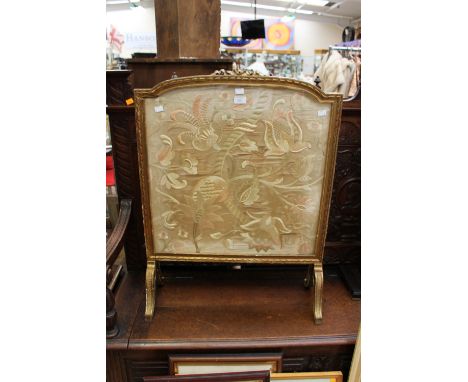An embroidered firescreen with initials EB1914, glazed to the front, fabric to the reverse, gilt gesso frame