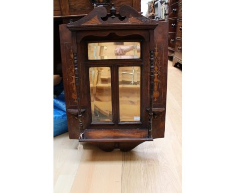 An Edwardian inlaid rosewood wall shelf with mirror inserts