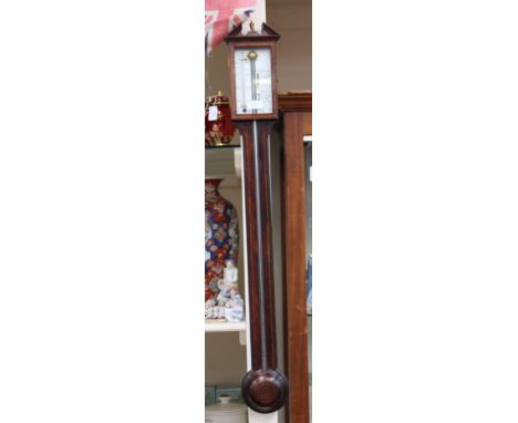 A traditional mercury stick barometer, with silvered gauge and thermometer