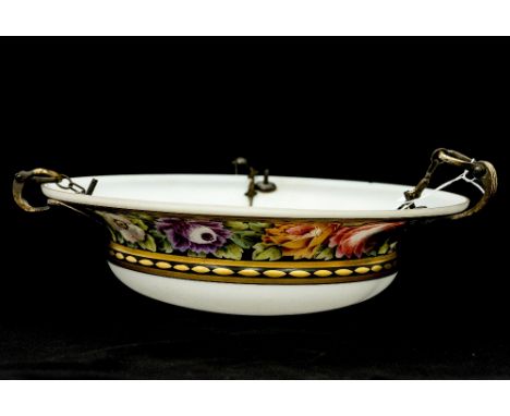 An early 20th Century circular ceiling light shade, opaque white painted wild flowers within a black and gilt border, chipped