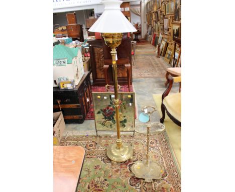 A brass stick/umbrella stand, a brass standard lamp and a brass surround glass painted fire screen (3)