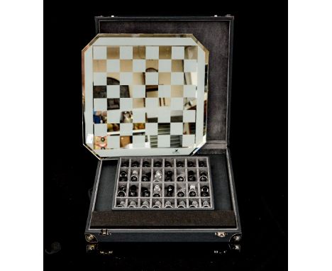 A boxed and cased Swarovski silver crystal chess set including Swarovski board and chess pieces, soft leatherette case, all i