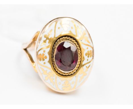 A garnet and white enamel gold ring, 19th century ring size K