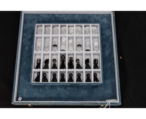 A Swarovski chess Set, with black and white clear glass chess pieces, complete with board, boxed
