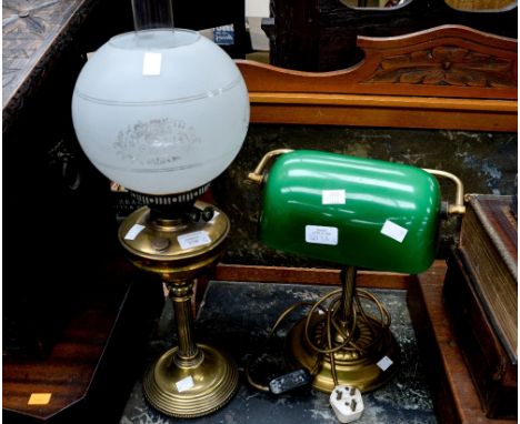 A brass and metal desk lamp with green glass shade and a 19th Century brass oil lamp (2)