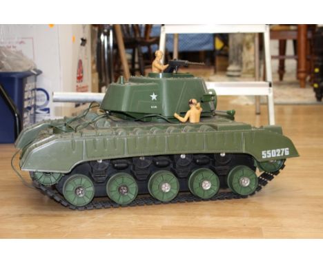 A plastic toy model of a tank,