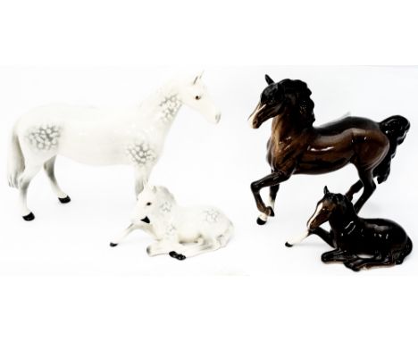 A Beswick figure of a horse and foal, brown, together with a dapple grey horse and foal (4)