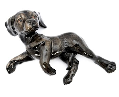 A Goebel dog lying 