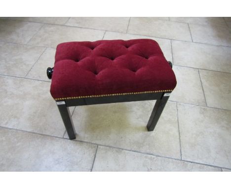 Piano Stool New stock
A bright ebonised adjustable piano stool with a red velvet button down seat.