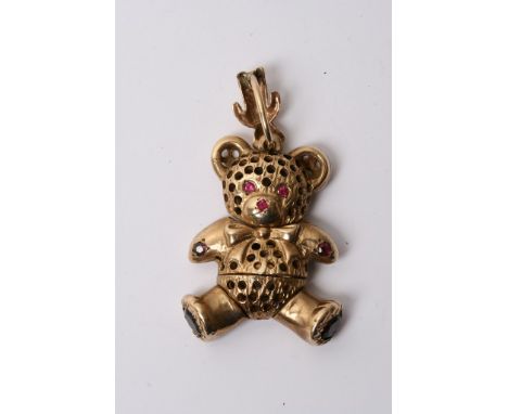 A large 9ct gold teddy bear pendant drop inset with red stones