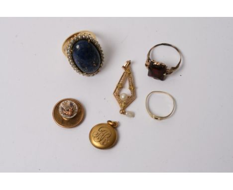 A gold ring inset with a polished blue stone, and sea pearl, an American enamel blue badge and various other oddments 