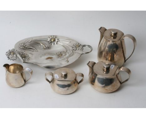 A 1930's Belgium Art Deco four piece silver plated tea set by Wiskmann of innovative form comprising of a tea pot, hot water 