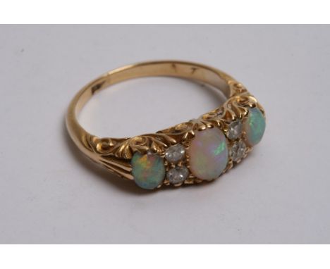  A quality 18ct gold diamond and opal ring