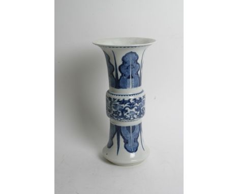 A Chinese blue and white Gu shaped porcelain vase decorated with archaic designs and having double ring mark to the base. Hei