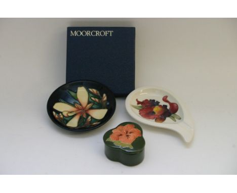 Three items of Moorcroft comprising a 2004 Panache pin dish, ash tray and Hibiscus on green ground trinket box (3)