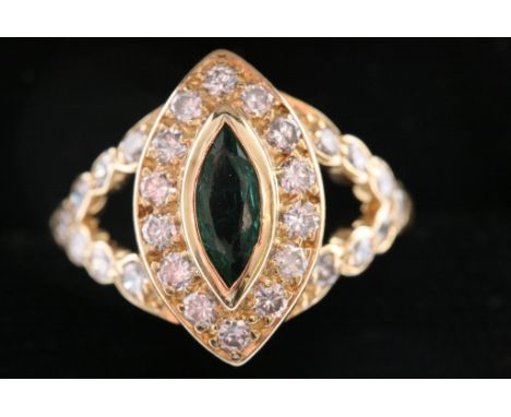 A quality ladies 18ct gold ring set with a marquise cut emerald with diamond surround and having further diamond set shoulder