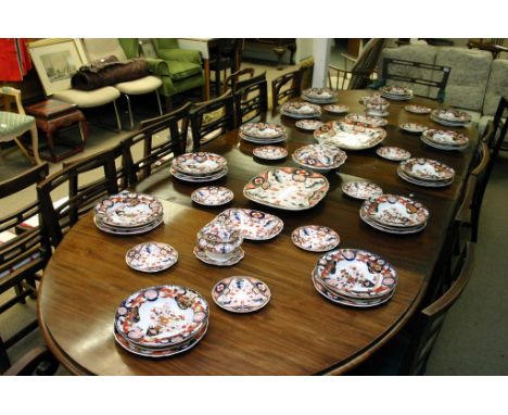 An extensive Victorian ceramic dinner service, with a Derby style pattern with red, deep blue guilt 