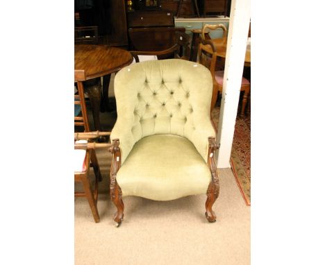 A quality Victorian walnut occasional chair with green button back upholstery on carved cabriole legs. 