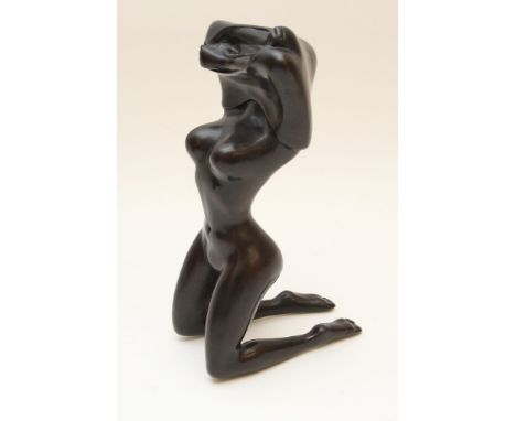 A sculptural composition study of a female nude removing an item of clothing over her head