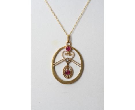 A 14ct gold vintage pendent inset with Ruby's and seed pearls 