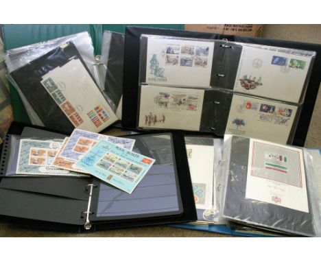 Three albums of first day covers including Great Britain, Tuvalu, Nauru etc and an album of common wealth mint stamps