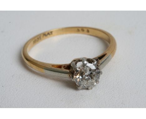 An 18ct gold ring inset with a brilliant cut vintage solitaire diamond