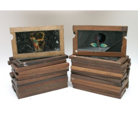 A collection of 24 Magic lantern mechanical sliding slides