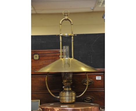 A good quality brass hanging lamp with brass shade and bracket