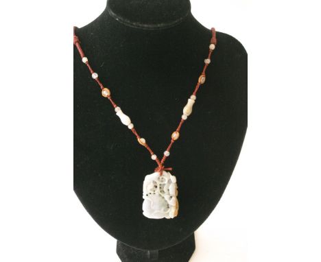 A carved jade pendant