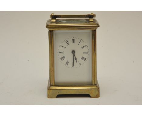 A brass cased carriage clock with key