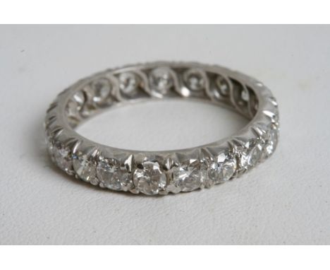 A quality white gold and diamond eternity ring