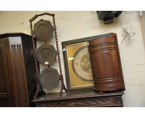 An oak cake stand with barley twist supports a framed embroidery and a stick stand (3) 