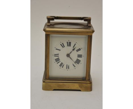A brass cased carriage clock wiith key