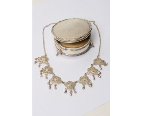 An Asprey London Hallmarked 1920s silver trinket box of circular shape on three legs together with a vintage silver necklace.