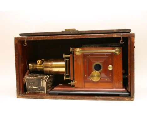 A mahogany case magic lantern, maker Newton and Co. 