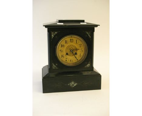 A black slate mantle clock