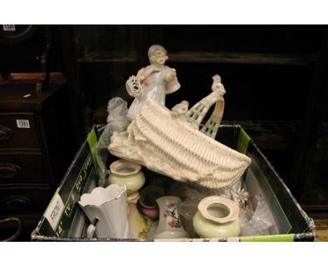 A box containing ceramic vases and figures