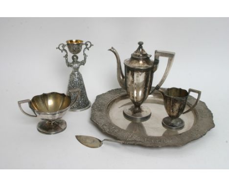 A continental marriage cup, a small white metal trowel, a plated tea set and a tray